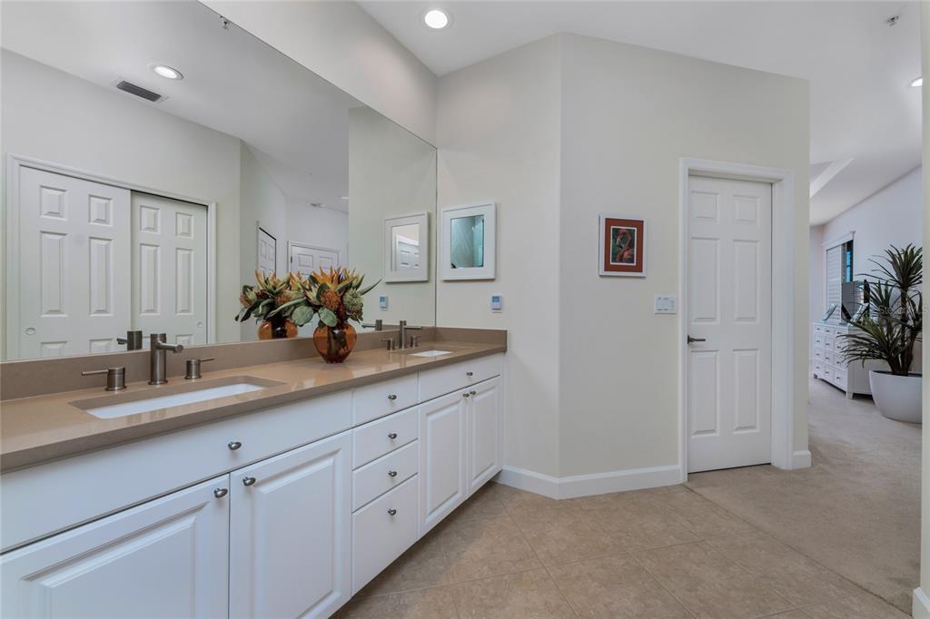 3316 Sunset Key Circle, Unit D Punta Gorda, FL 33955 - Photo 37 of 68 a bathroom with a sink and a mirror