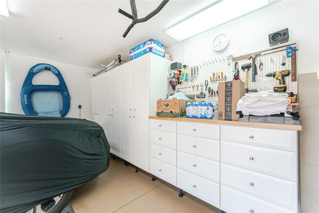 3316 Sunset Key Circle, Unit D Punta Gorda, FL 33955 - Photo 38 of 68 a bedroom with a bed and a dresser