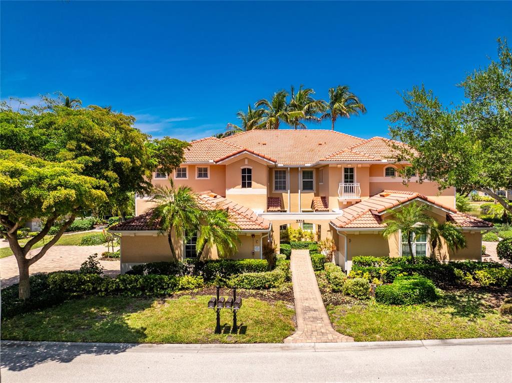 3316 Sunset Key Circle, Unit D Punta Gorda, FL 33955 - Photo 42 of 68 a front view of a house with a yard