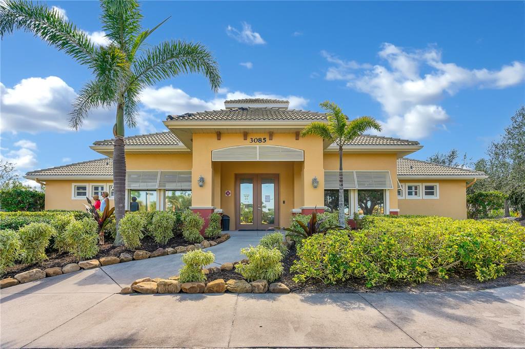 3316 Sunset Key Circle, Unit D Punta Gorda, FL 33955 - Photo 67 of 68 front view of a house with a garden