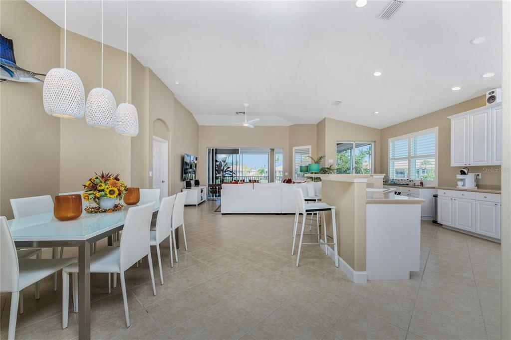 3316 Sunset Key Circle, Unit D Punta Gorda, FL 33955 - Photo 8 of 68 a living room with kitchen island furniture and a dining table