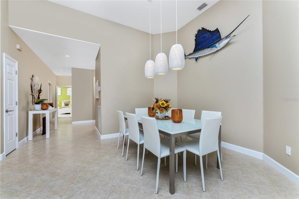 3316 Sunset Key Circle, Unit D Punta Gorda, FL 33955 - Photo 10 of 68 a view of a dining room with furniture and wooden floor