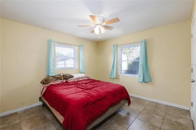a bedroom with a bed and window