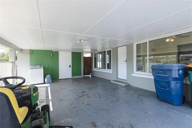 a view of a livingroom with furniture and windows