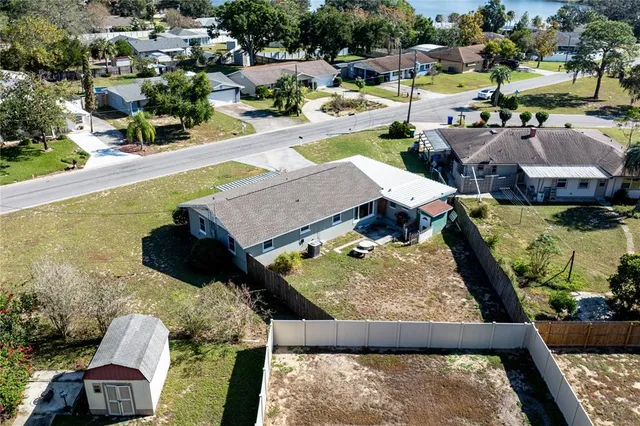 swimming pool view with a lake view