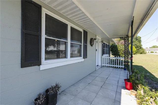 a view of a house with a flower garden