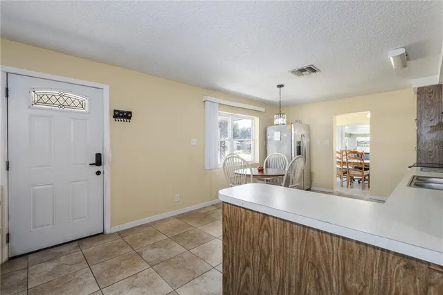 a view of a bathroom with a sink a mirror and a bathtub