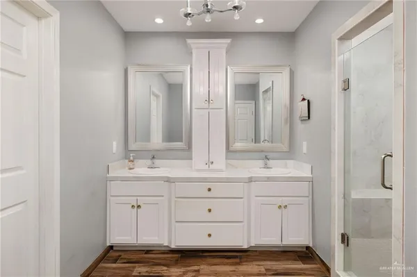 a bedroom with furniture and a flat screen tv