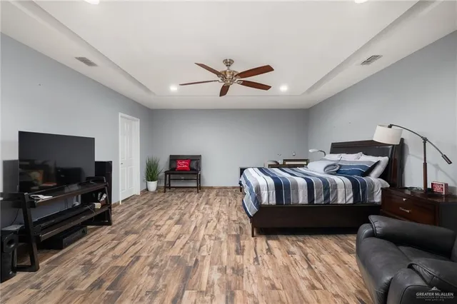 a kitchen with a refrigerator a microwave a sink and cabinets