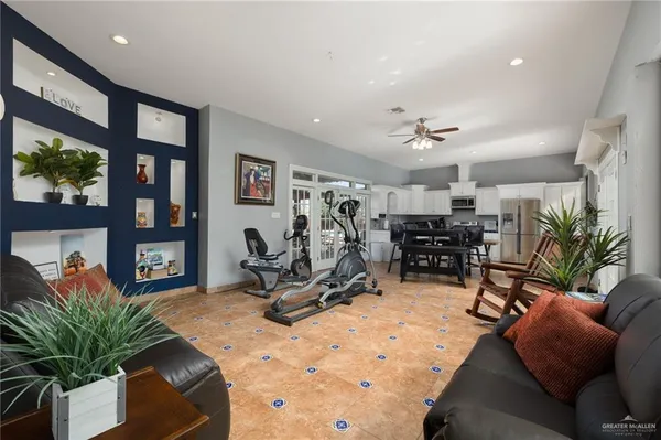 a bathroom with a granite countertop sink mirror and a shower