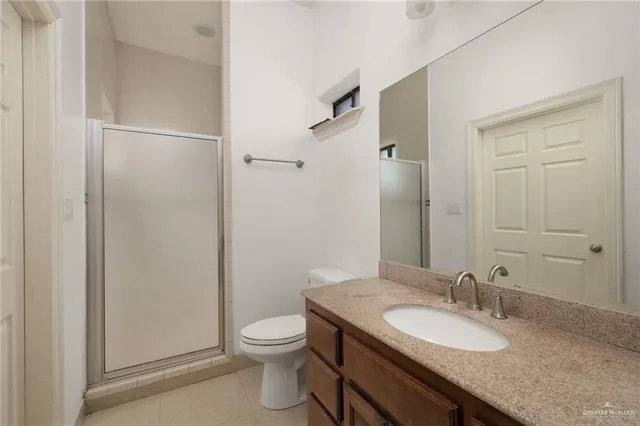 an empty room with a ceiling fan and window