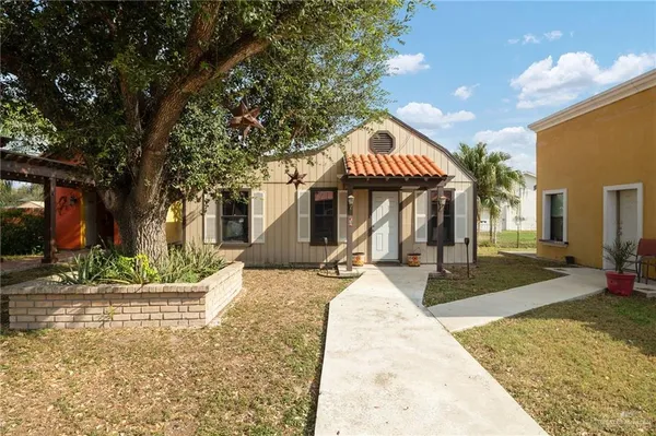 a front view of a house with porch and livingroom