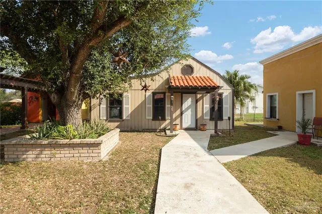a front view of a house with porch and livingroom