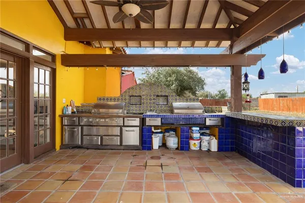 a view of a chairs and table in the patio