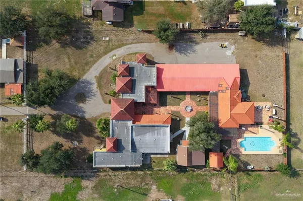 an aerial view of a house with outdoor space