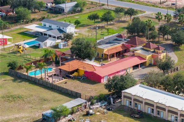 an aerial view of residential houses and lake view
