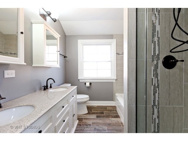 570 Byrd Road Riverside, IL 60546 - Photo 14 of 16 a bathroom with a sink and a mirror