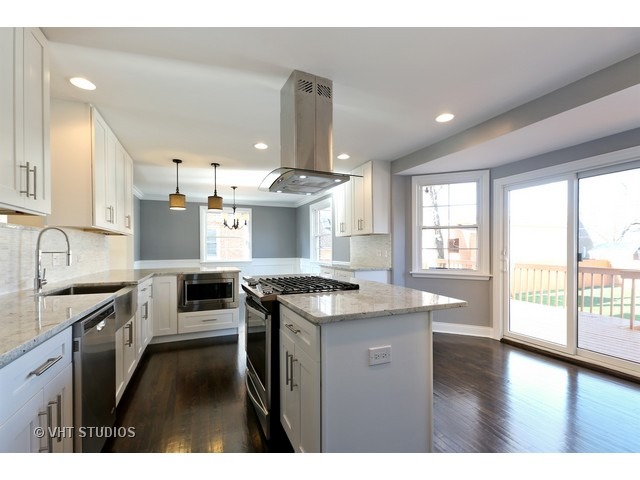 570 Byrd Road Riverside, IL 60546 - Photo 4 of 16 a kitchen with granite countertop a sink stove and cabinets