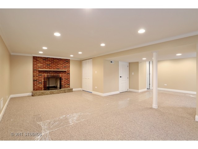 570 Byrd Road Riverside, IL 60546 - Photo 7 of 16 a view of an empty room with a fireplace