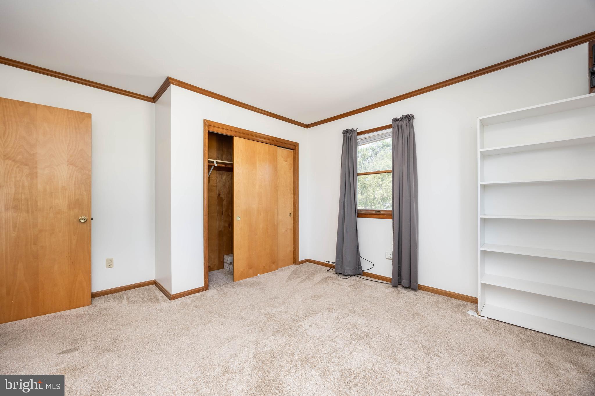 9830 Sharptown Road Mardela Springs, MD 21837 - Photo 31 of 51 a view of an empty room with closet and a window