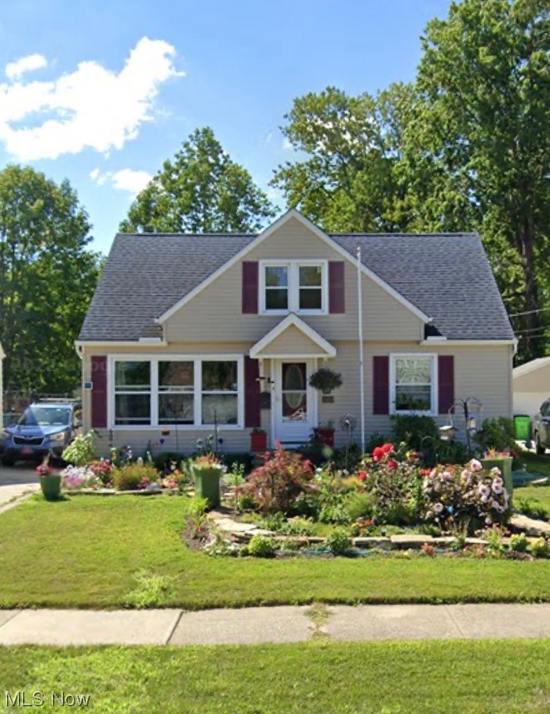 View of front of property with a front lawn