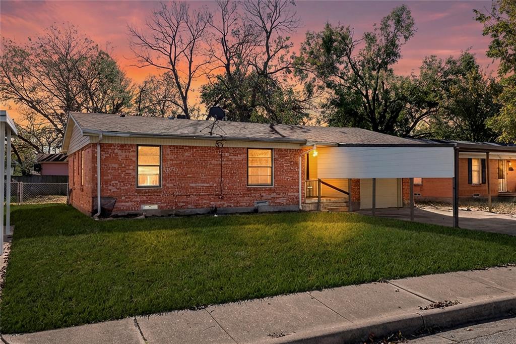 1406 Ridgeview Street Mesquite, TX 75149 - Photo 1 of 16 a front view of a house with a garden