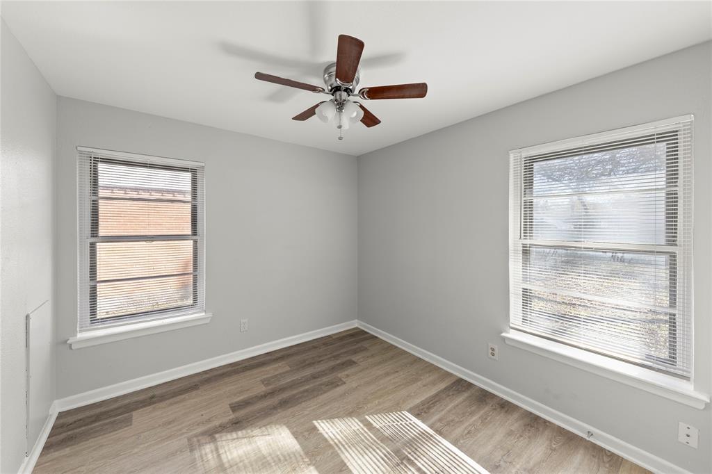 1406 Ridgeview Street Mesquite, TX 75149 - Photo 12 of 16 a view of empty room with wooden floor and fan