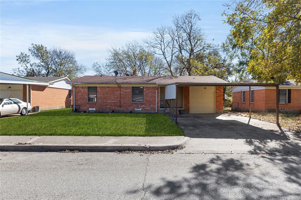 1406 Ridgeview Street Mesquite, TX 75149 - Photo 3 of 16 a front view of a house with a garden and plants