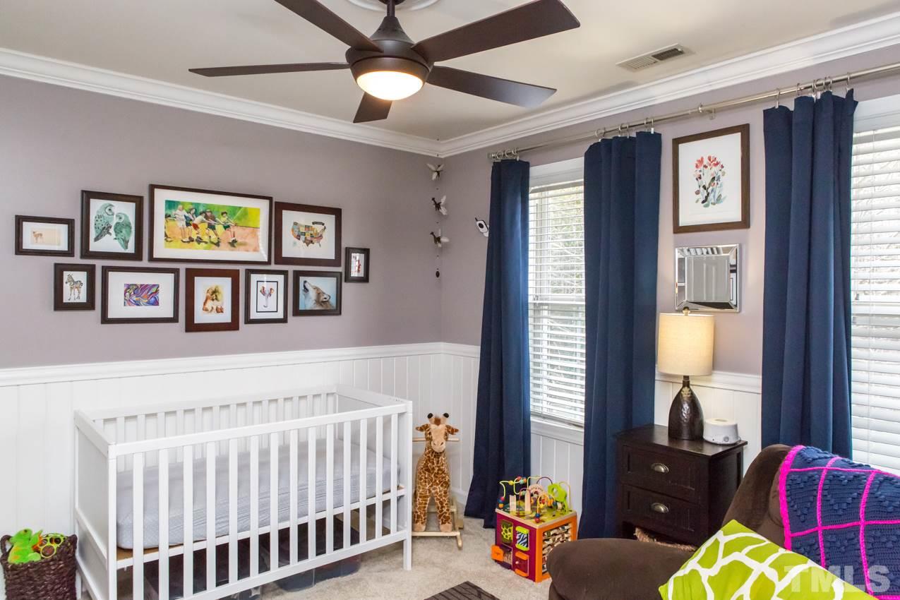 9108 Castleton Lane Raleigh, NC 27615 - Photo 20 of 25 a bedroom with furniture and a window