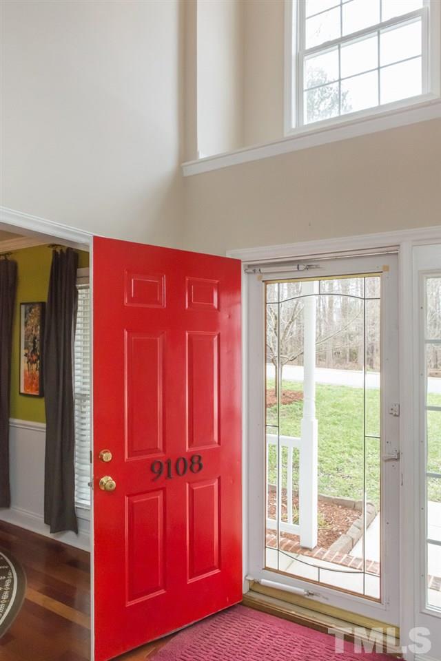 9108 Castleton Lane Raleigh, NC 27615 - Photo 3 of 25 a view of front door with wooden floor