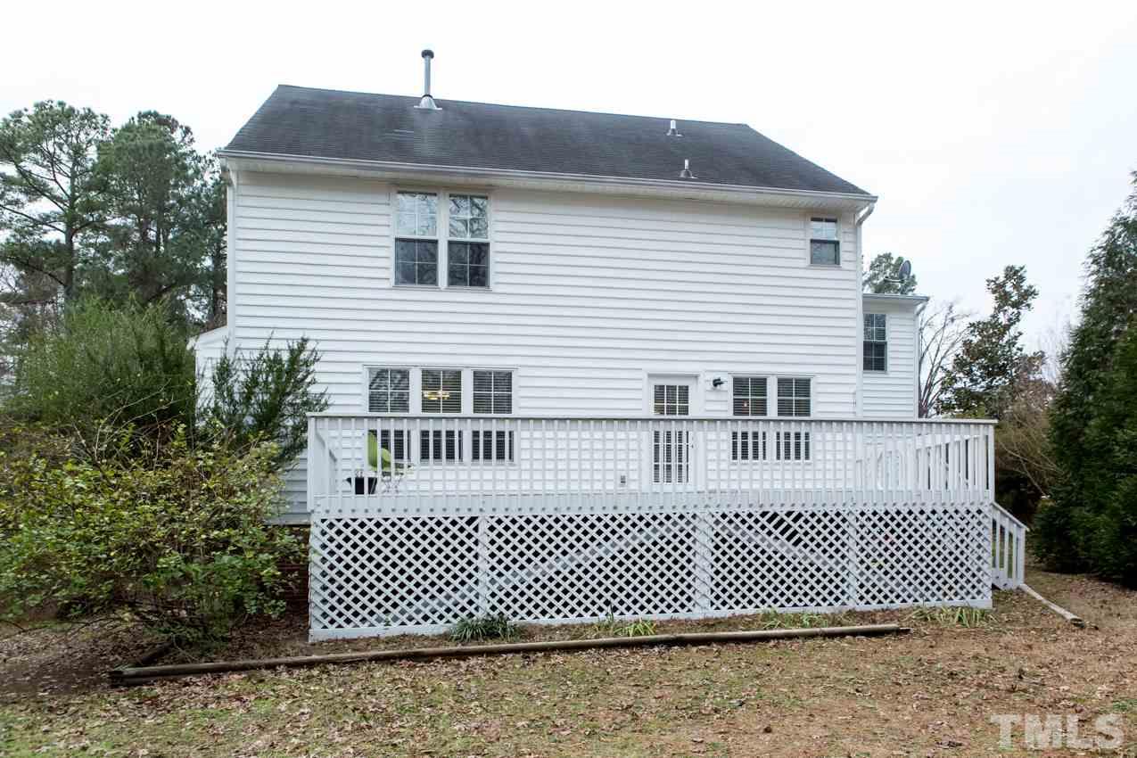 9108 Castleton Lane Raleigh, NC 27615 - Photo 23 of 25 a front view of a house with a yard