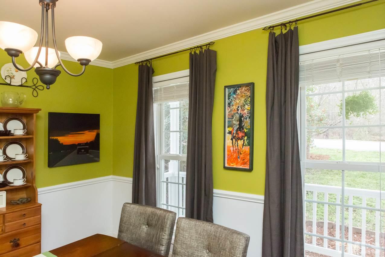 9108 Castleton Lane Raleigh, NC 27615 - Photo 5 of 25 a view of a door with a fireplace and a window