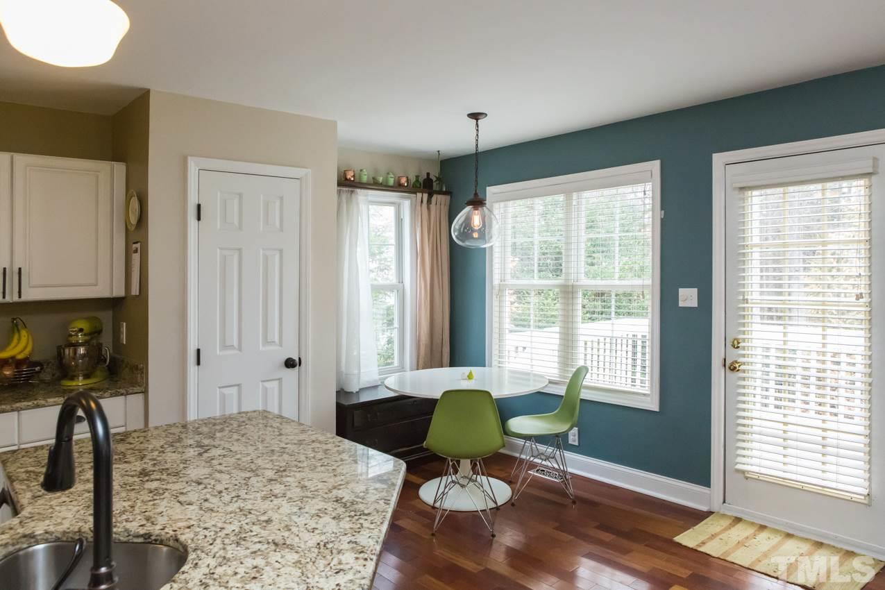 9108 Castleton Lane Raleigh, NC 27615 - Photo 8 of 25 a living room with a couch and a window