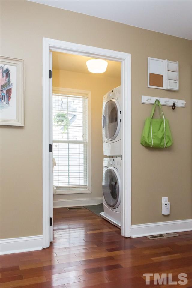 9108 Castleton Lane Raleigh, NC 27615 - Photo 9 of 25 a view of a bedroom with washer and dryer