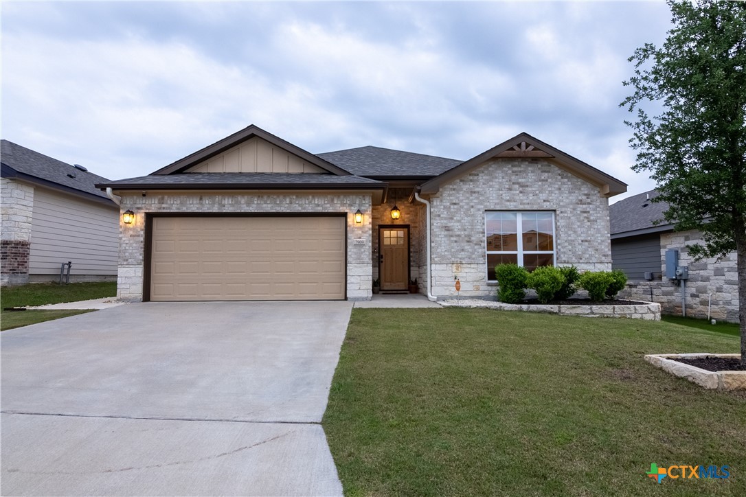 7909 McCulloch Road Temple, TX 76502 - Photo 46 of 46 a front view of a house with a yard and garage