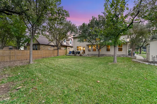 a view of a yard with tree s