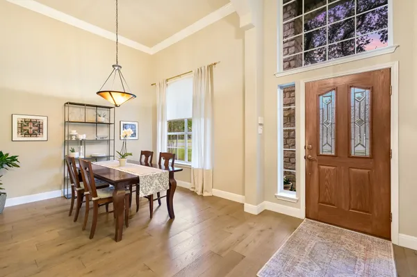 a view of a dining room with furniture window and wooden floor