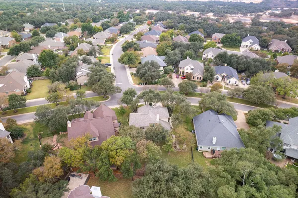 an aerial view of residential building with green space