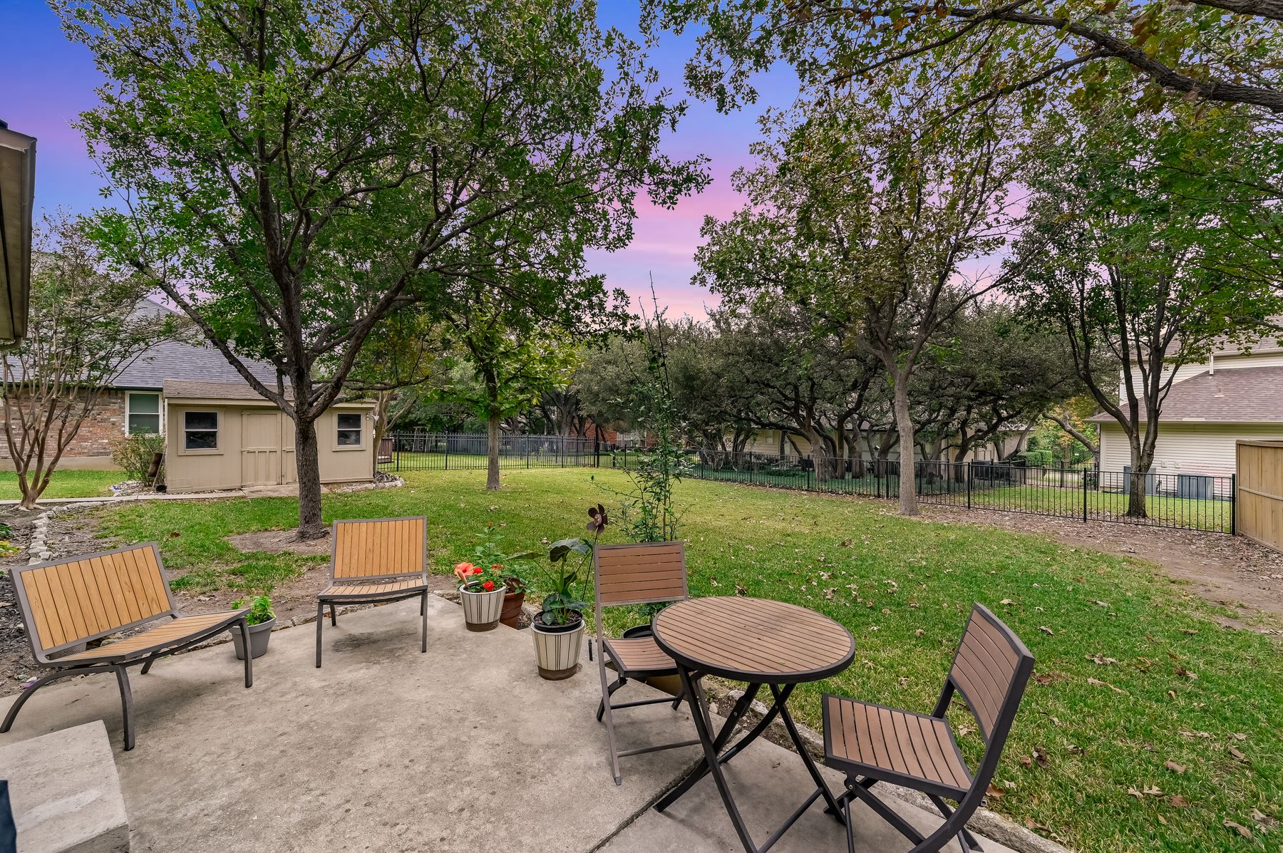 300 River Ridge Drive Georgetown, TX 78628 - Photo 4 of 32 Patio terrace at dusk with a patio and a fenced backyard
