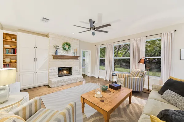 a living room with furniture and a fireplace