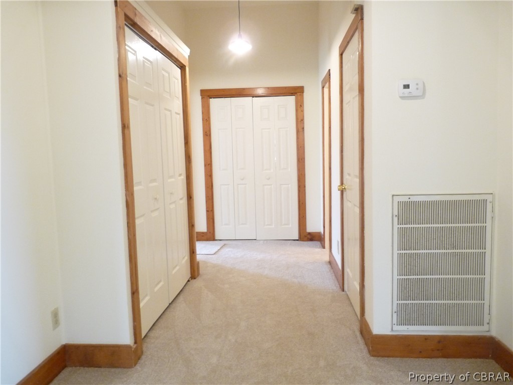 1379 Centerville Road Shacklefords, VA 23156 - Photo 27 of 30 Hall way with washer and dryer closet at the end