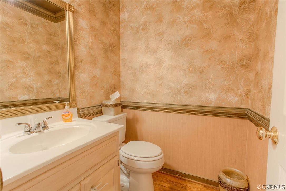 5501 Windy Ridge Court Midlothian, VA 23112 - Photo 9 of 31 a bathroom with a sink a toilet and a mirror
