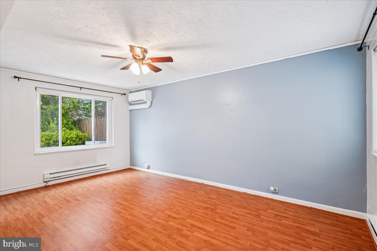 47 Ridge Road Greenbelt, MD 20770 - Photo 13 of 38 wooden floor in an empty room with a window