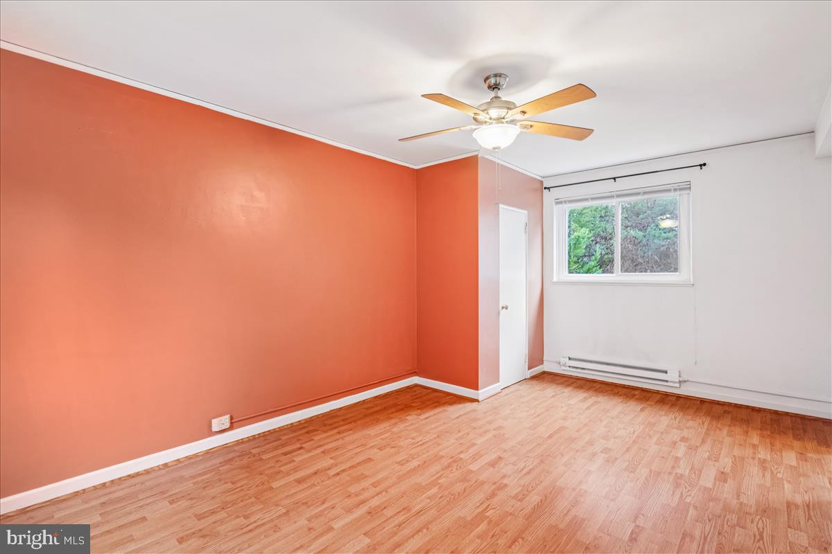 47 Ridge Road Greenbelt, MD 20770 - Photo 20 of 38 wooden floor in an empty room with a window