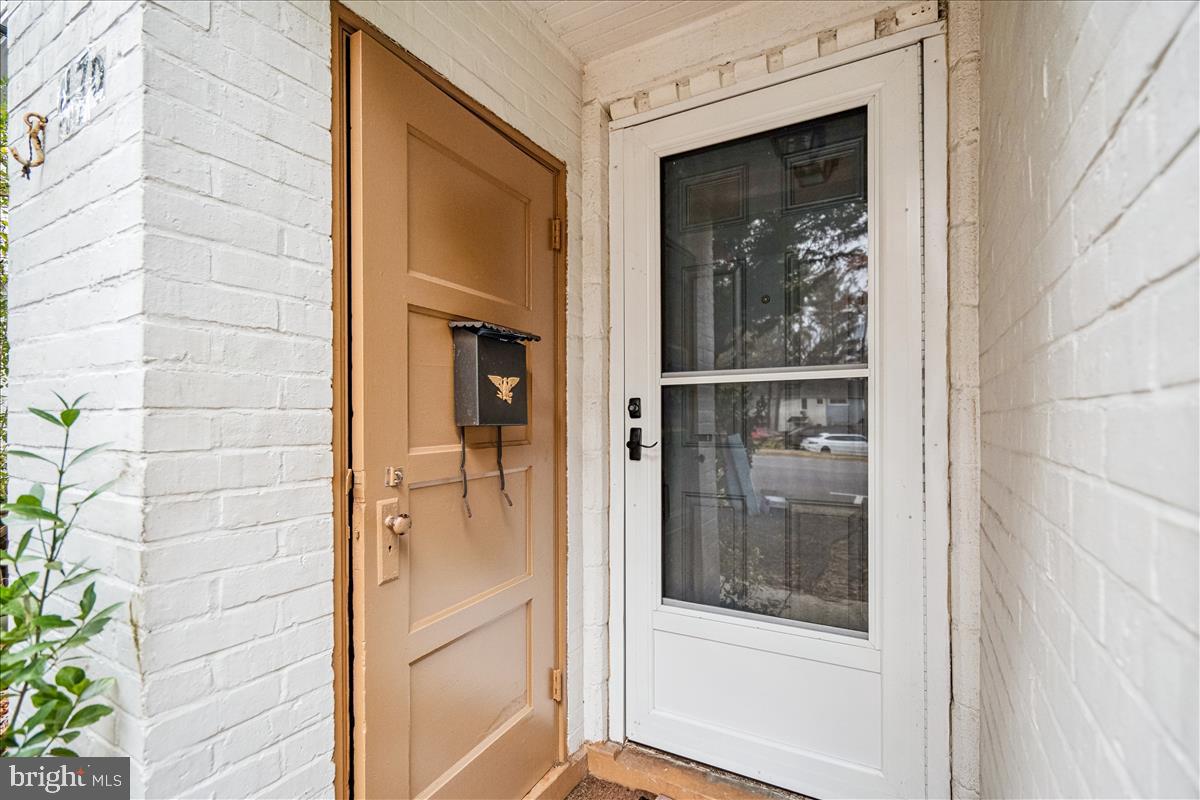 47 Ridge Road Greenbelt, MD 20770 - Photo 2 of 38 a bathroom with a glass door and a shower