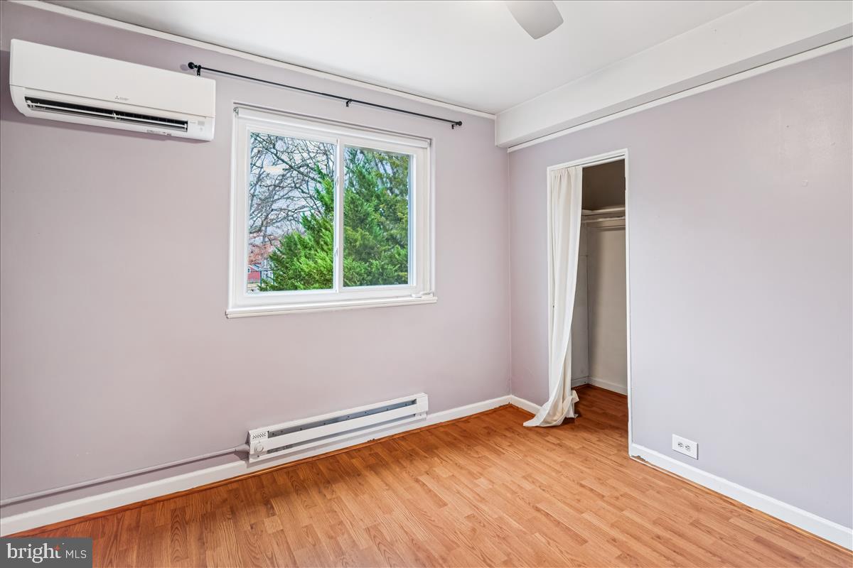47 Ridge Road Greenbelt, MD 20770 - Photo 25 of 38 a view of a room with wooden floor and white walls