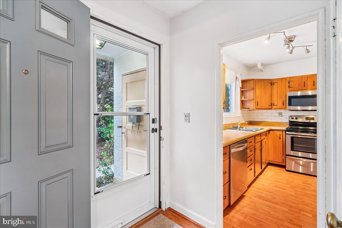 47 Ridge Road Greenbelt, MD 20770 - Photo 3 of 38 a view of a kitchen with a sink and dishwasher