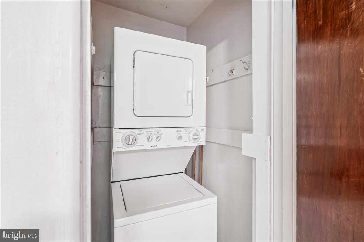 47 Ridge Road Greenbelt, MD 20770 - Photo 31 of 38 a utility room with dryer and washer