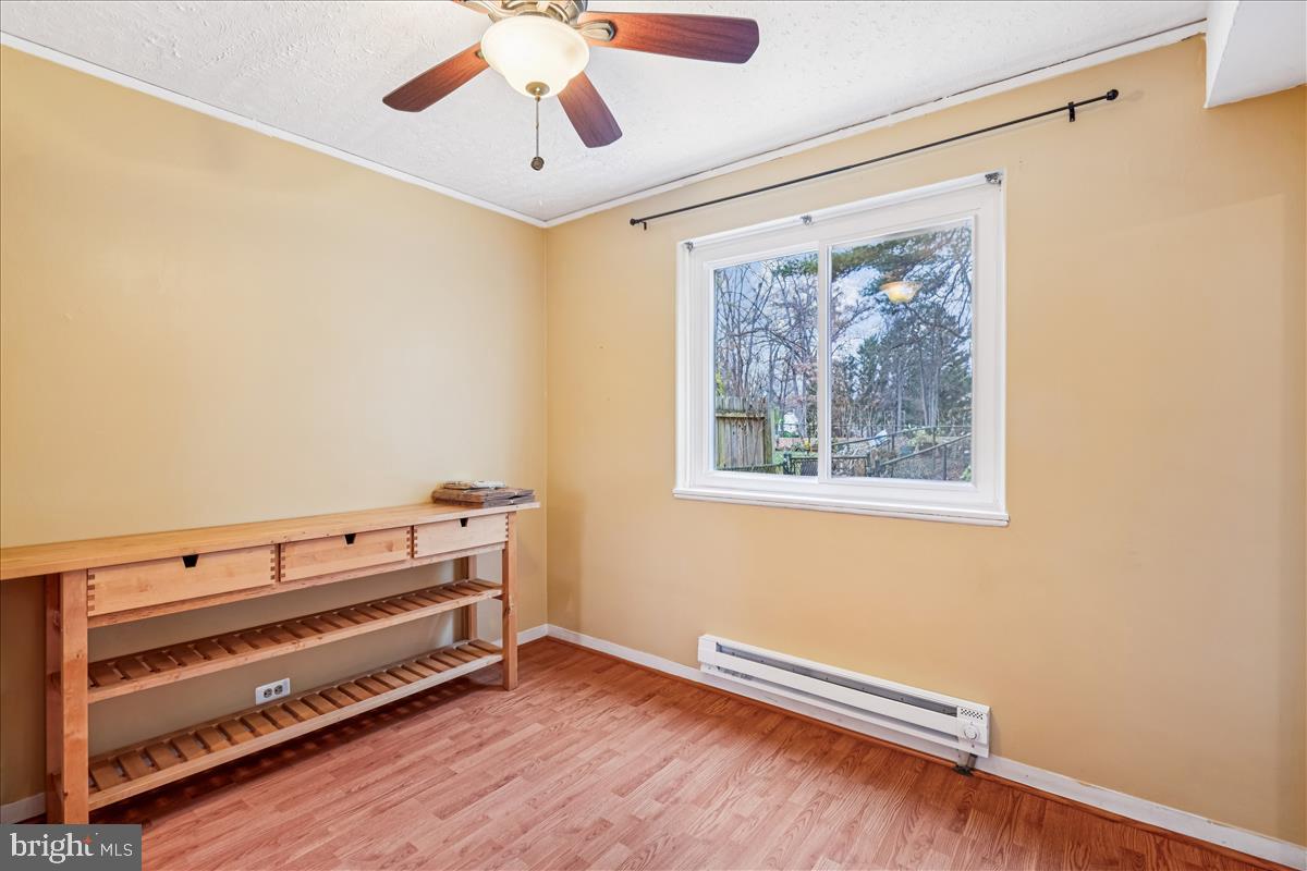 47 Ridge Road Greenbelt, MD 20770 - Photo 5 of 38 a view of room with window and wooden floor