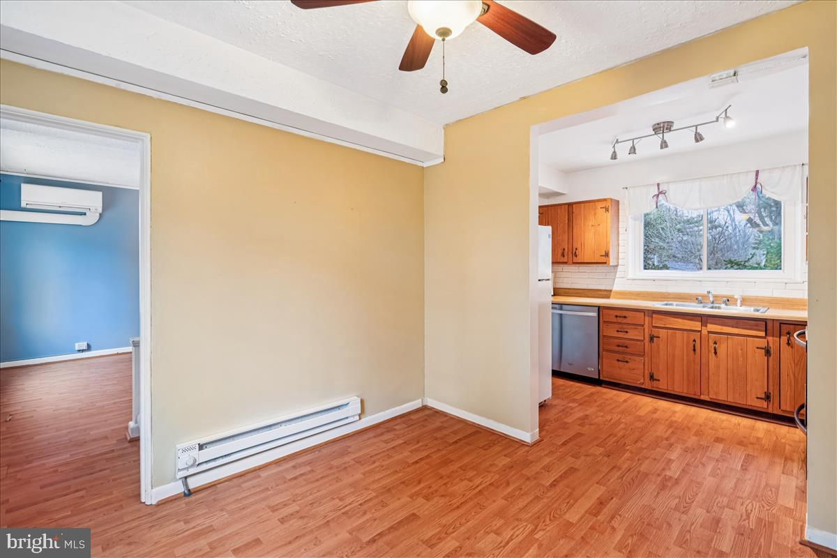 47 Ridge Road Greenbelt, MD 20770 - Photo 8 of 38 a kitchen with a refrigerator and a sink